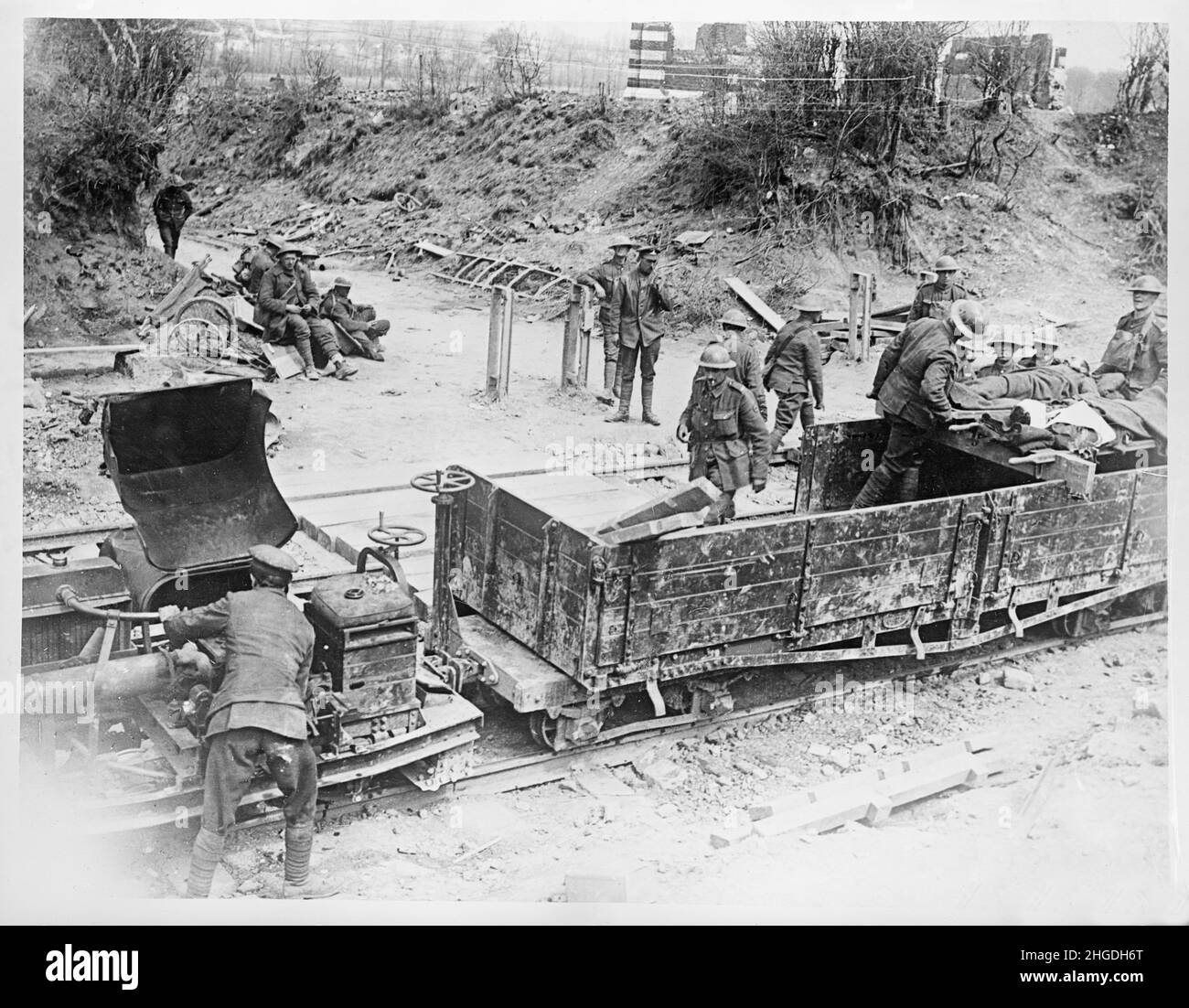 A vintage photo of British soldiers evacuating wounded men using a petrol powered Motorrail Simplex 20hp Tractor engine and light railway wagons on the Western front at Arras circa 29th April 1917. Powered by 20hp Dorman 2JO petrol engine Simplex locos were used for the supply of ammunition and stores, the transport of troops and the evacuation of the wounded Stock Photo