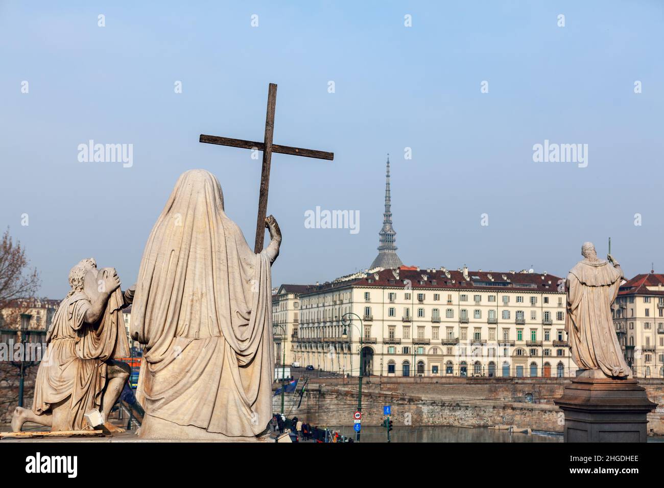 Sculptures located in front of Gran Madre Church in Turin. Religious statue with cross Stock Photo