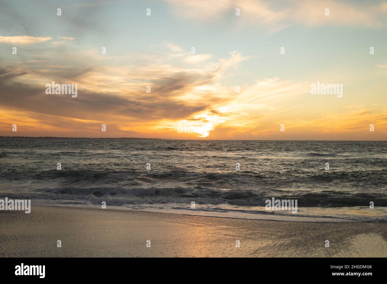 Beach shore waves sunset sand hi-res stock photography and images - Alamy