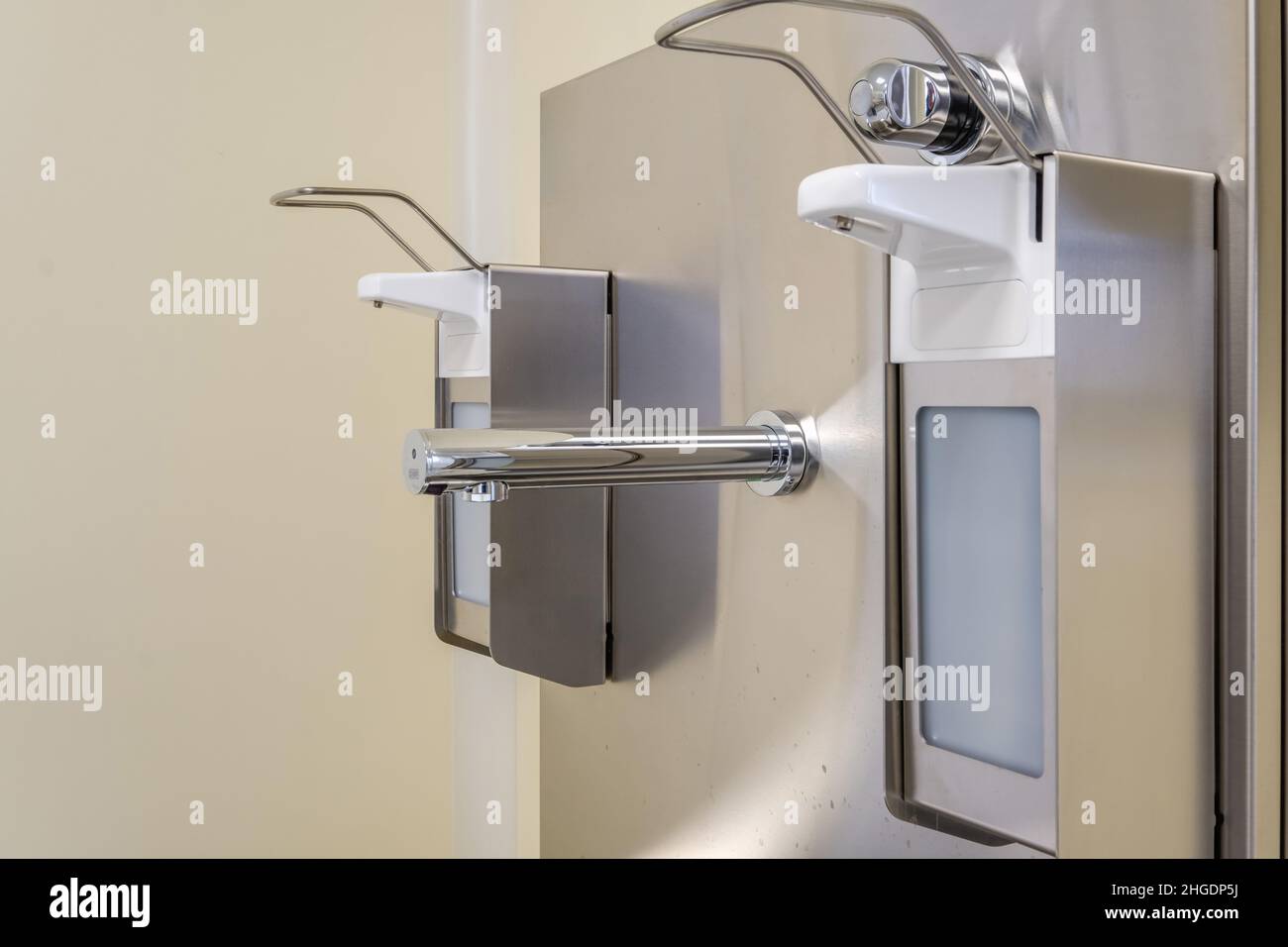 elbow soap and antiseptic dispenser or sanitizer wall mounted for hand