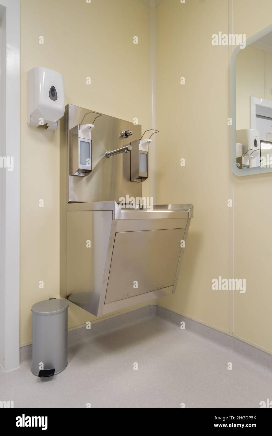 elbow soap and antiseptic dispenser or sanitizer wall mounted for hand