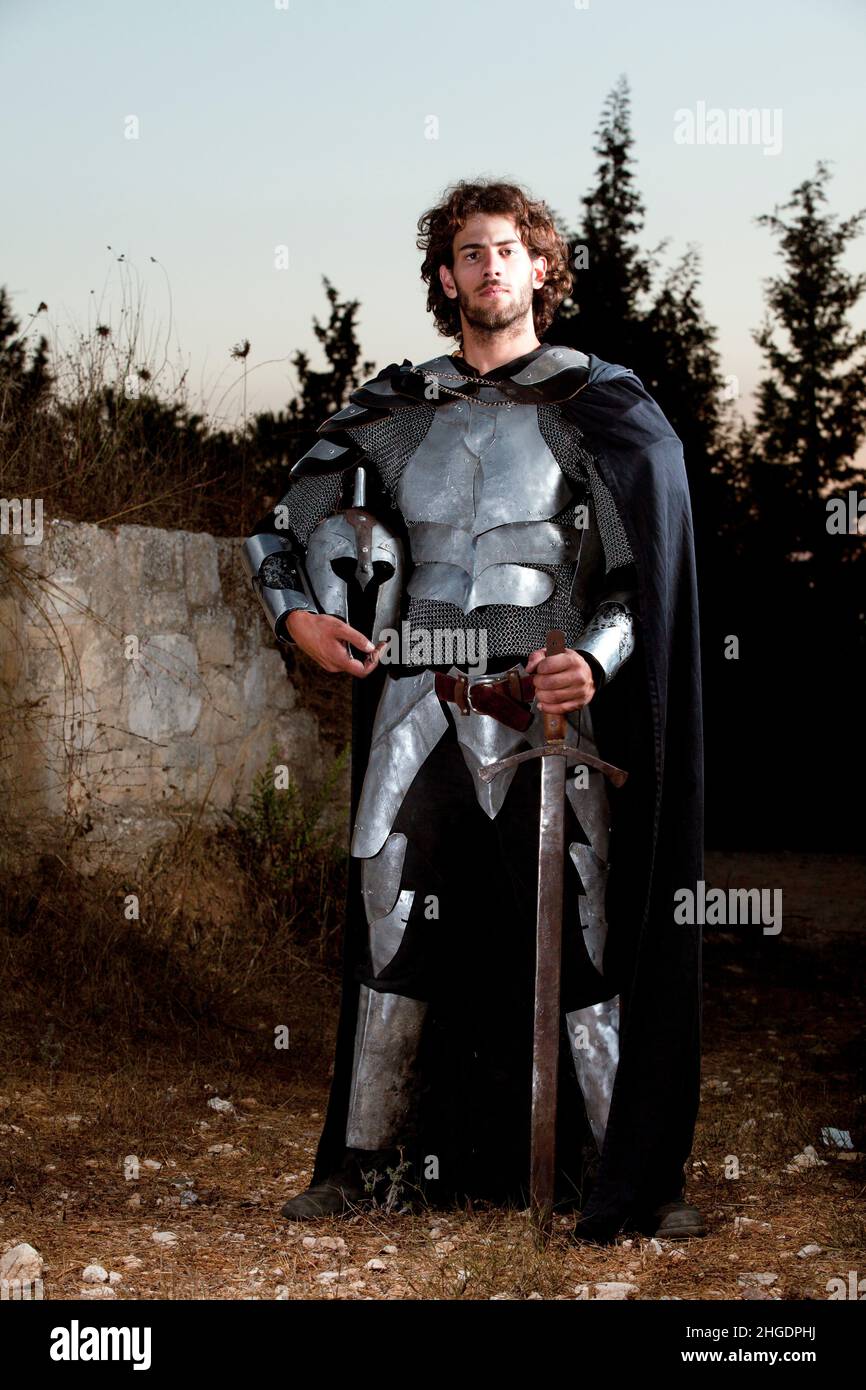 A  full body knight in shining armour at sunset. Model Release Available Stock Photo