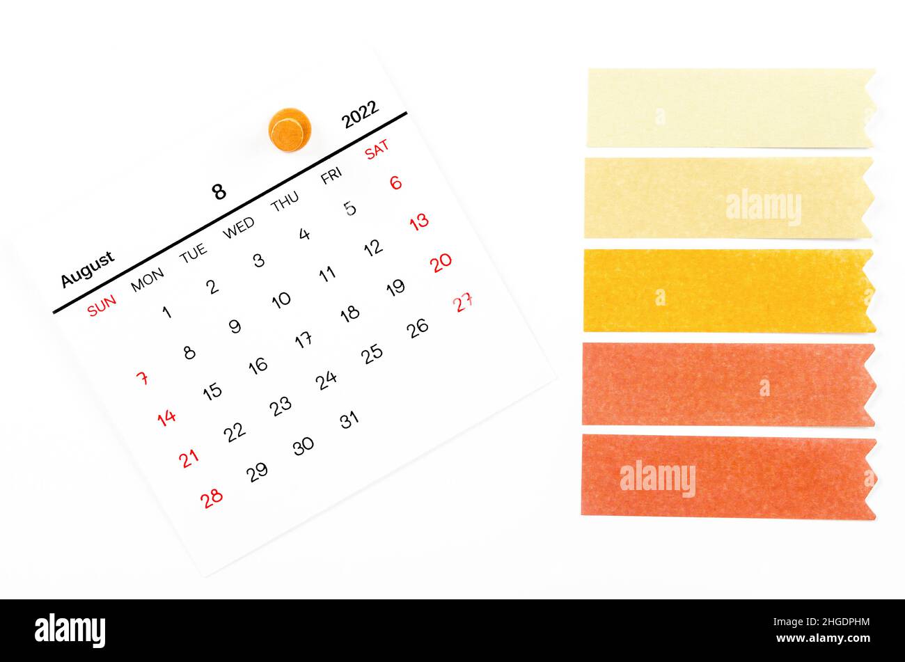 The August 2022 calendar with wooden push pin and blank adhesive note