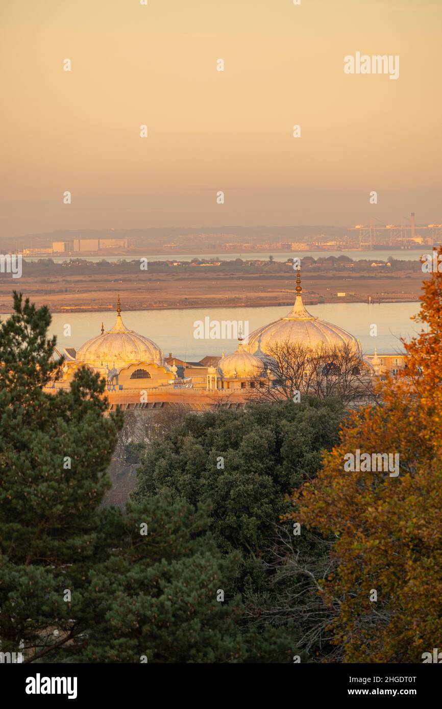 Looking towards London Gateway Port at Coryton. With the domes of the Gravesend Gurdwara in the foreground. From Windmill hill at Sunset. Stock Photo