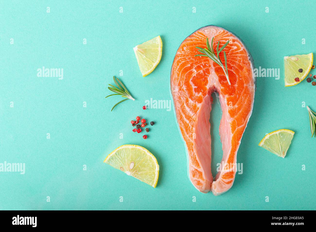 Raw fresh fish salmon steak top view on blue clean background from above Stock Photo