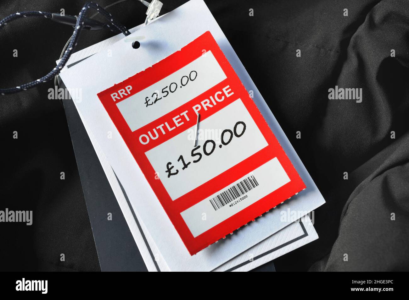 RETAIL CLOTHING OUTLET PRICE TAGS RE SALES DISCOUNT COST OF LIVING HIGH STREET SHOPS ETC UK Stock Photo