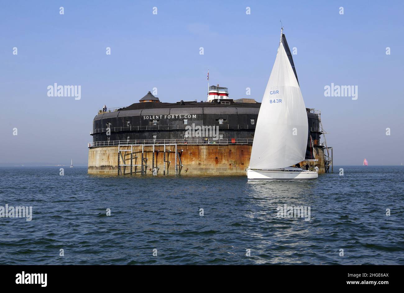 Yacht passing No Man's Land Fort. Solent, Isle of Wight Stock Photo