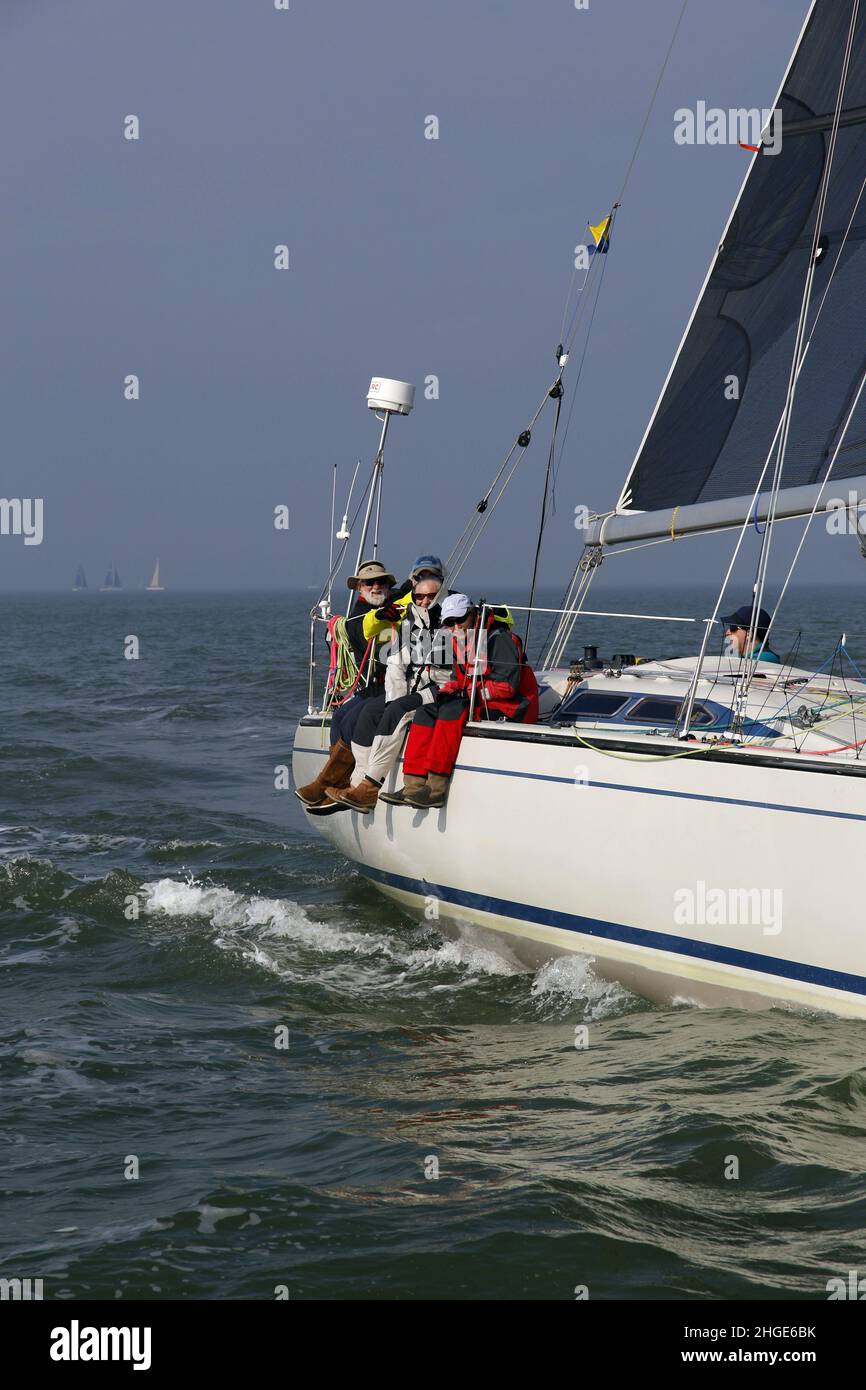 Riding the rail during a yacht race on The Solent Stock Photo