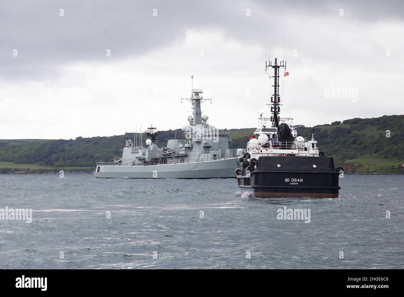 Portuguese Navy Frigate NRP Francisco de Almeida (F334) in Plymouth Sound with Naval Auxiliary SD Oban in attendance Stock Photo
