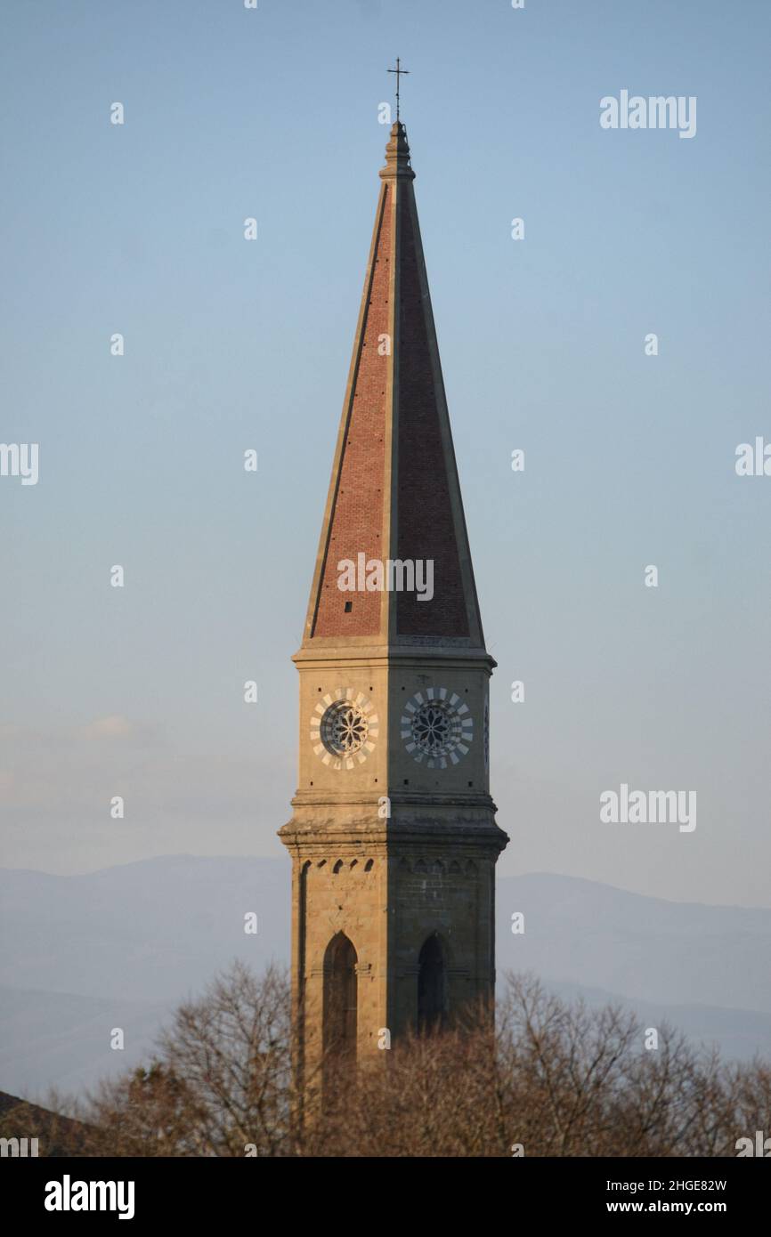 the steeple of the cathedral against blue sky at sunset Stock Photo