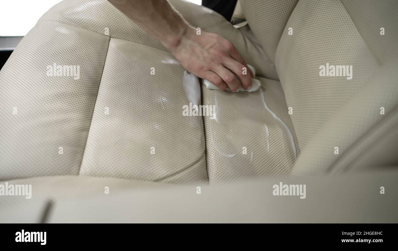 Dry cleaning of white leather interior. Dirty car interior. cleaning