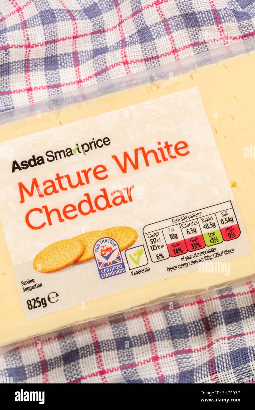 Plastic wrapper of ASDA budget own-label Mature Cheddar Cheese with dietary food label traffic light system showing cheese fat content, salt, etc. Stock Photo