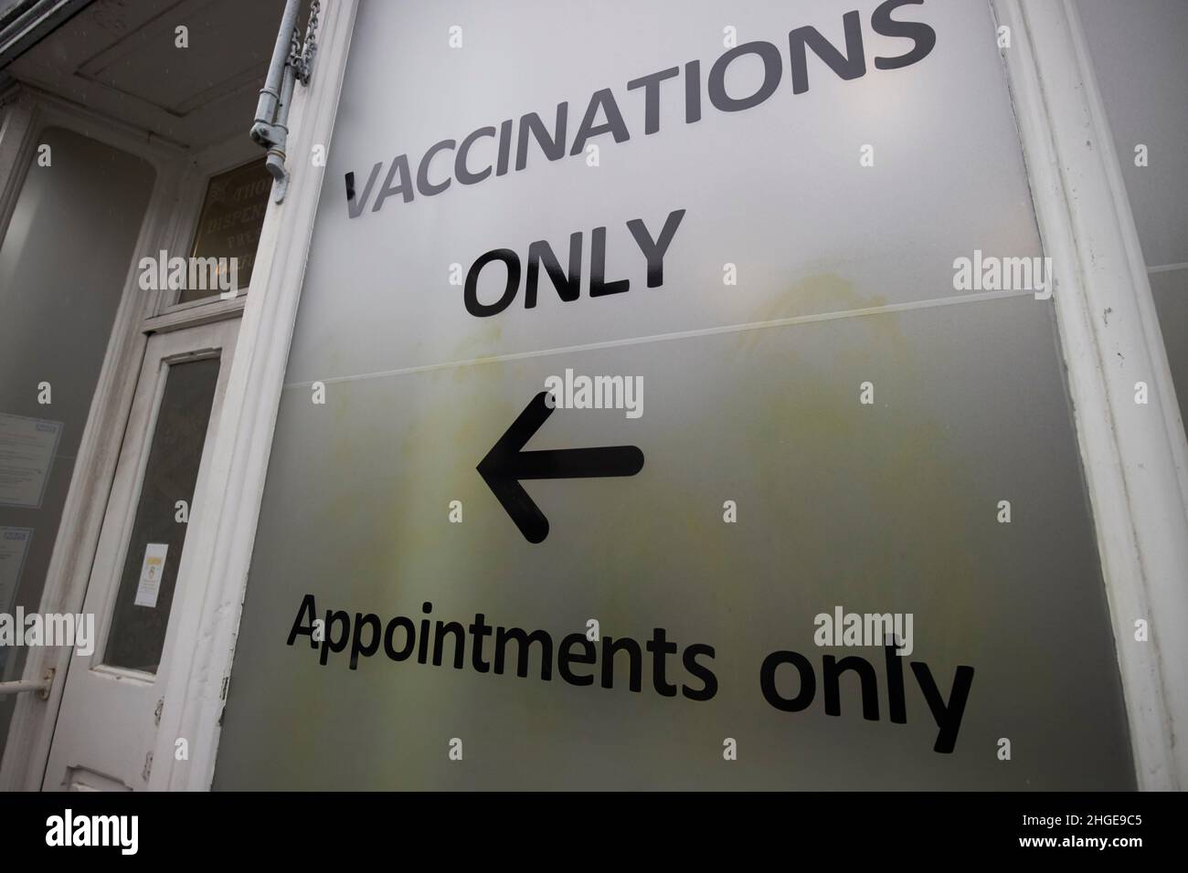 vaccinations only sign in the window of a chemist shop ambleside lake district, cumbria, england, uk Stock Photo