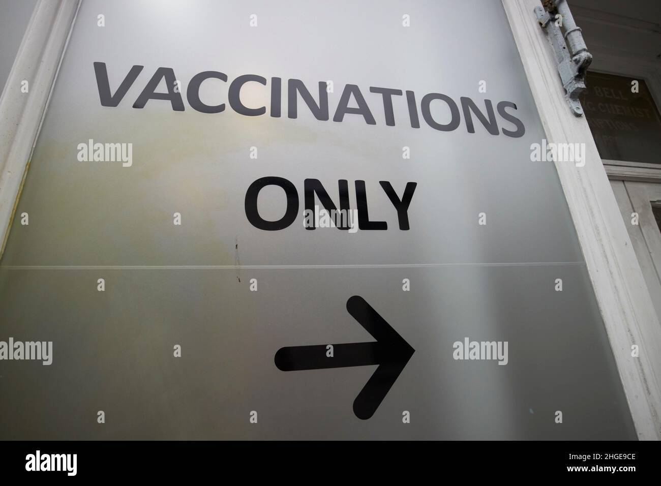 vaccinations only sign in the window of a chemist shop ambleside lake district, cumbria, england, uk Stock Photo