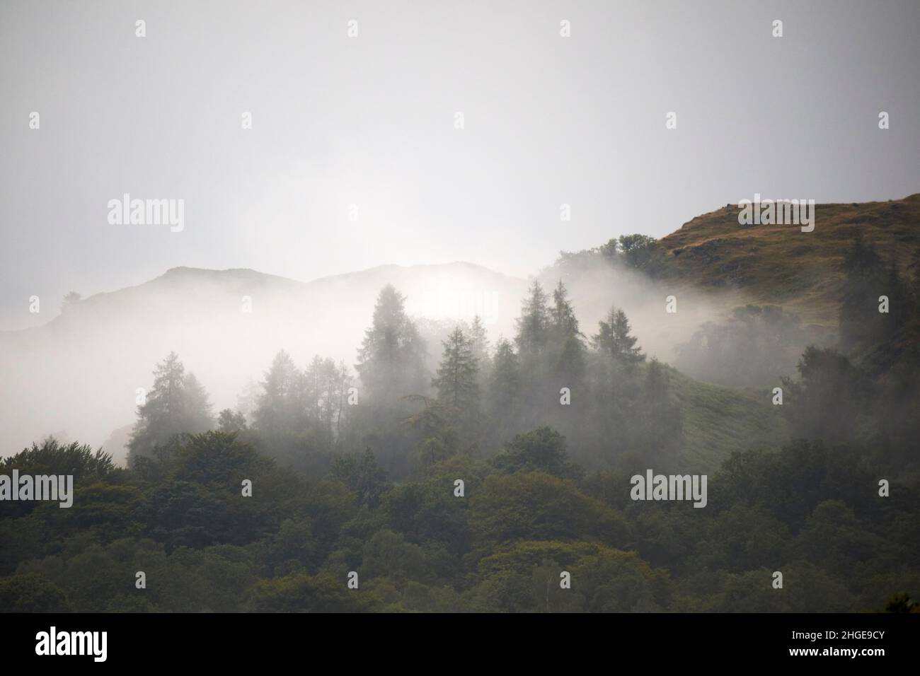 low mist and low cloud passing over the hills near skelwith bridge ambleside lake district, cumbria, england, uk Stock Photo
