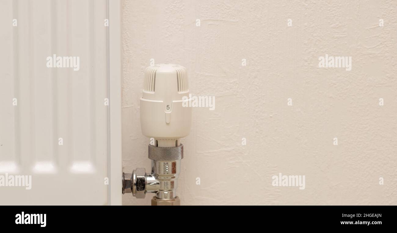 Close up of radiator and thermostat of a gas central heating system