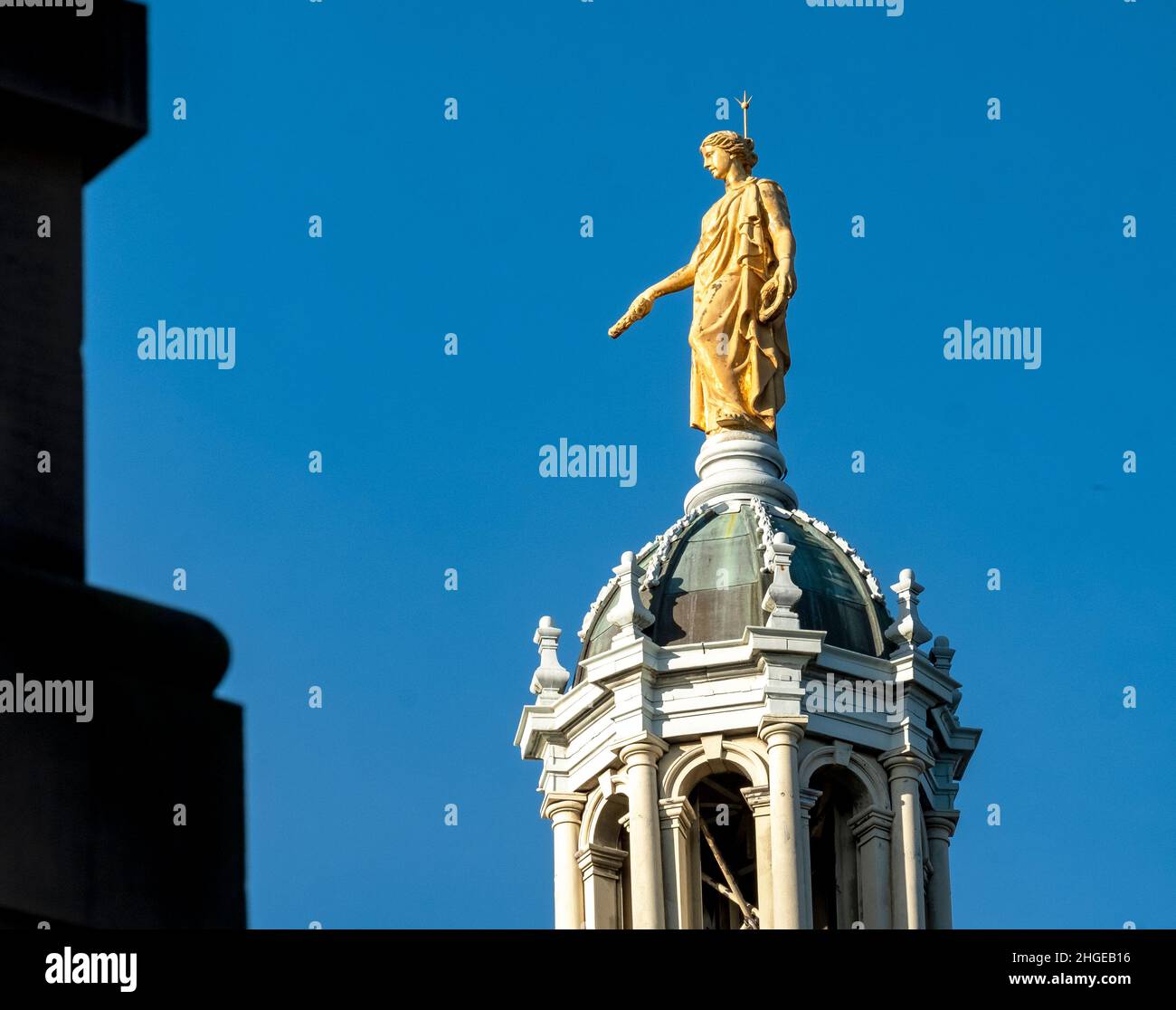 View of the gold statue statue representing Fame, on top of central octagonal dome of the Bank of Scotland, the Mound, Edinburgh. Stock Photo
