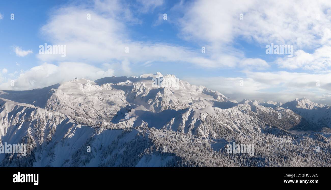 Aerial Panoramic View of Canadian Mountain covered in snow Stock Photo ...