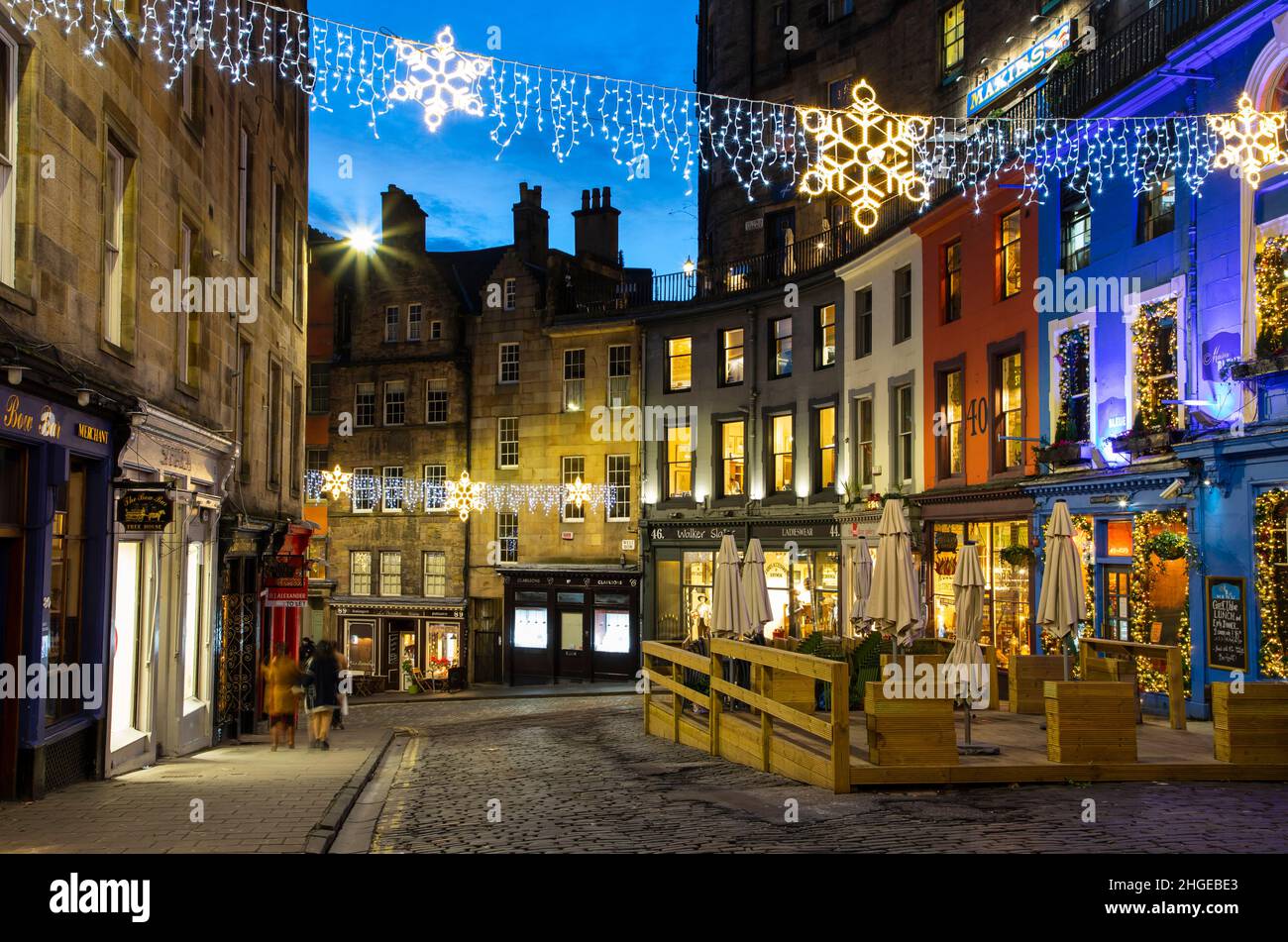 Edinburgh, UK - January 4th, 2022: Victoria Street is at the pretty part of Old Town Edinburgh with a long stretch of colourful storefronts and restau Stock Photo