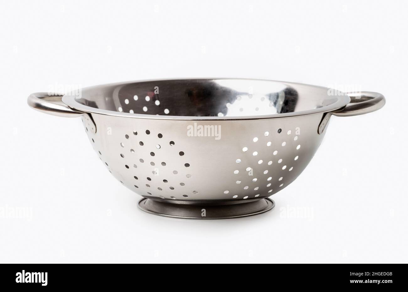 Empty silver colander isolated on white Stock Photo