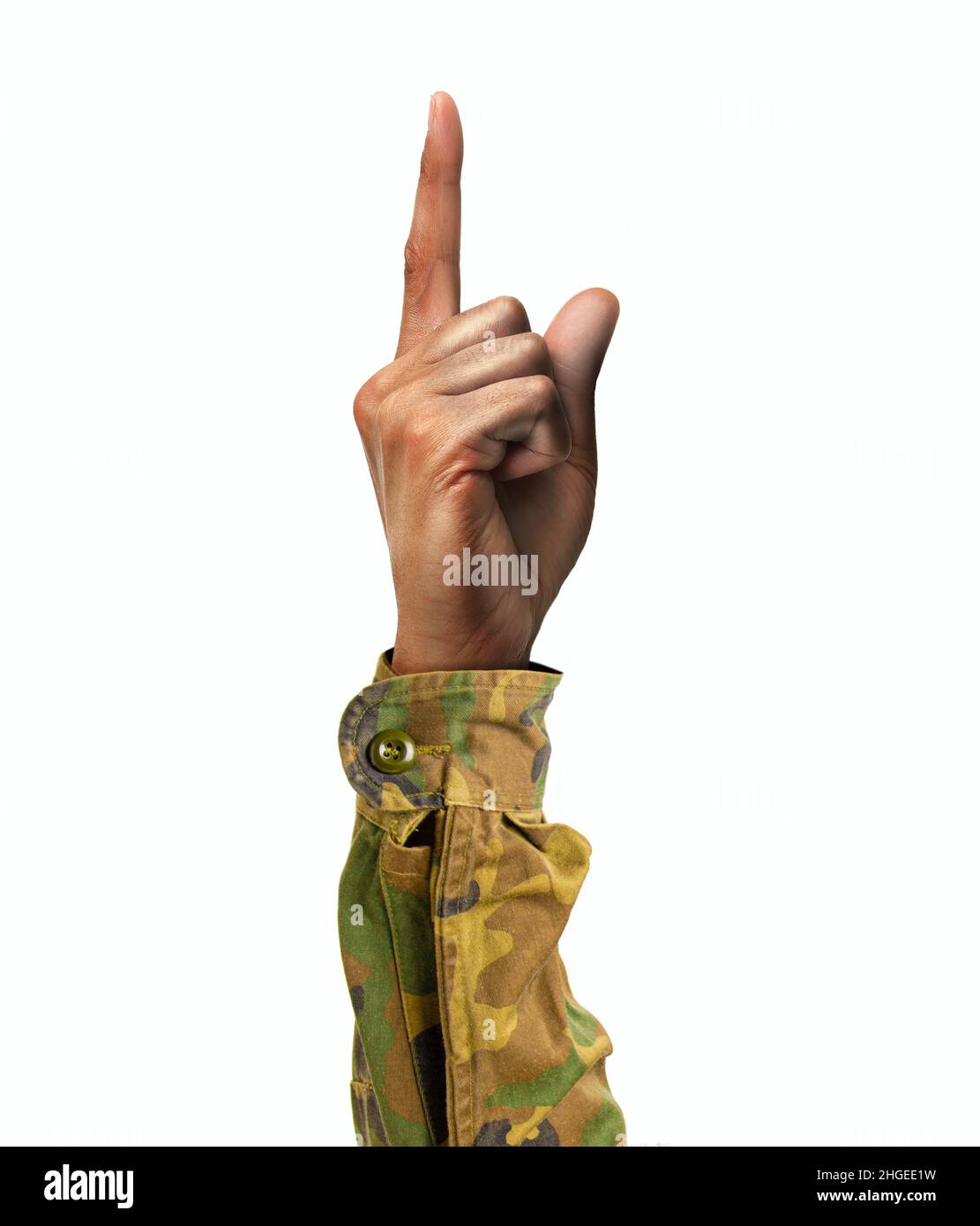 Soldier hand showing forefinger up and number one sign in a white isolated background Stock Photo