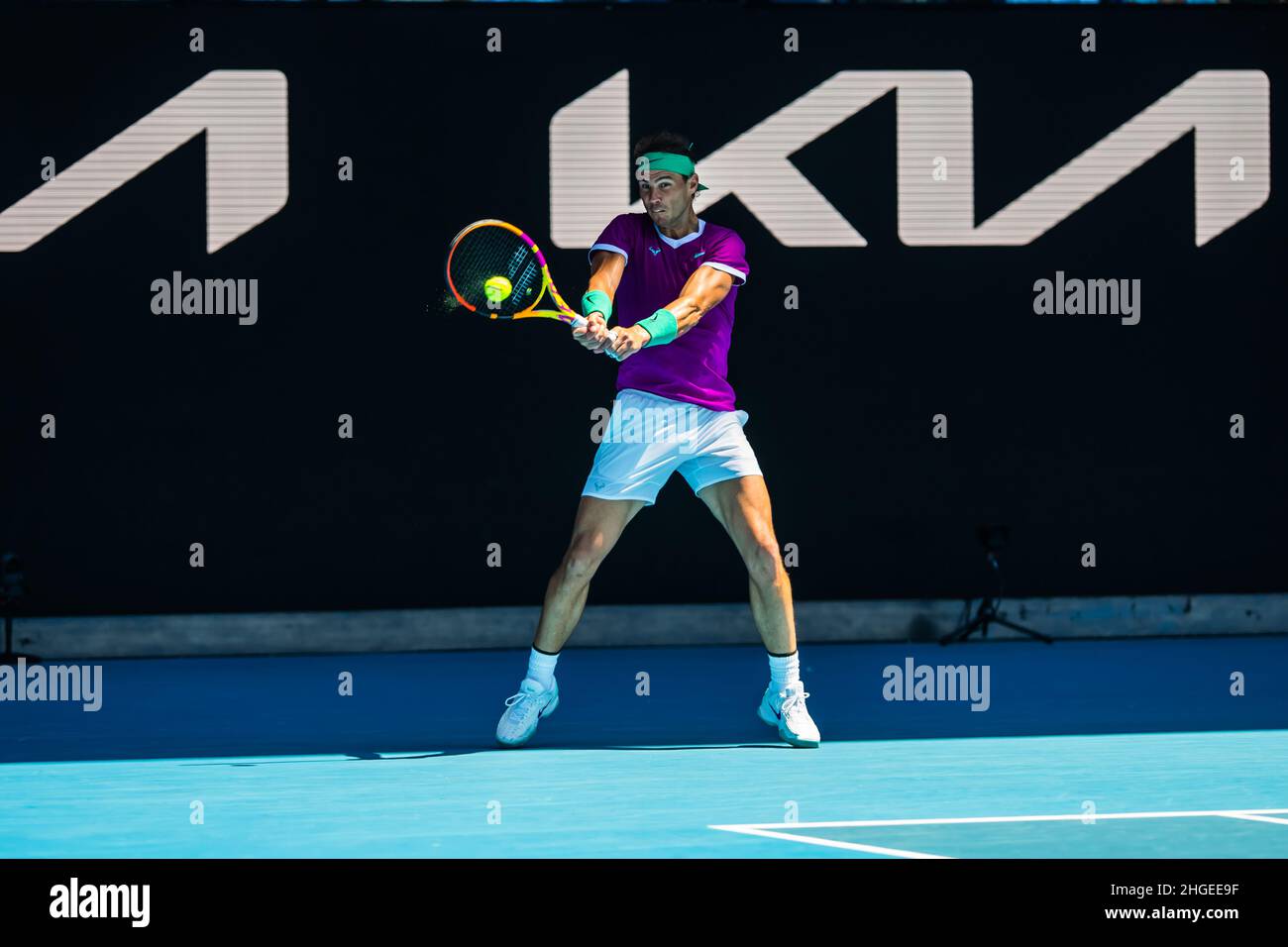 Rafael Nadal hitting the ball with his racquet during the match with Marcos Giron during the Australian Open 2022 Round 1 match of the Grand Slam at Rod Laver Arena in Melbourne Olympic Park.(Final score Nadal wins in 3 sets 6:1, 6:4, 6:2). Stock Photo