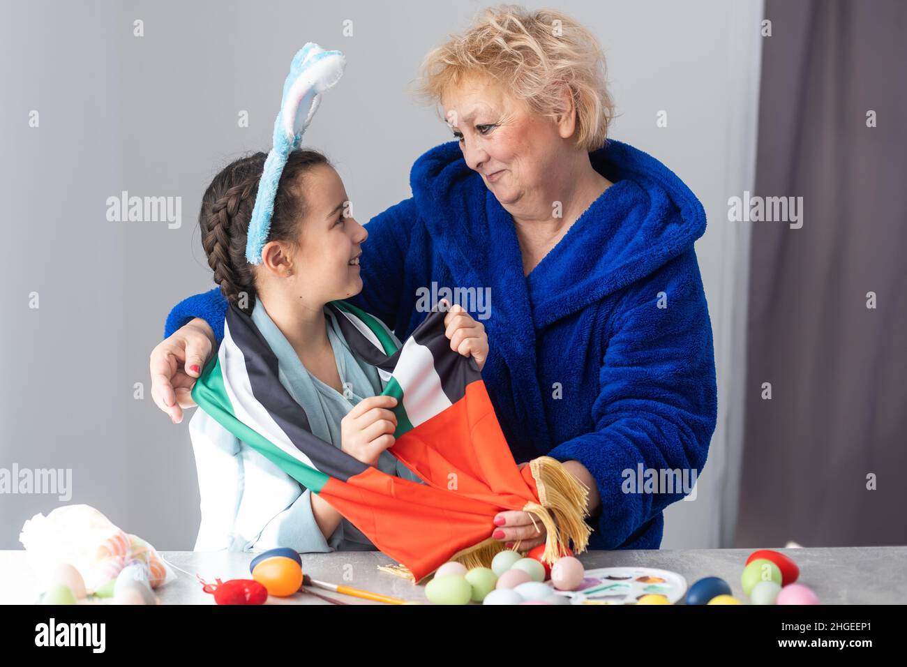 grandmother and granddaughter with uae flag for easter Stock Photo