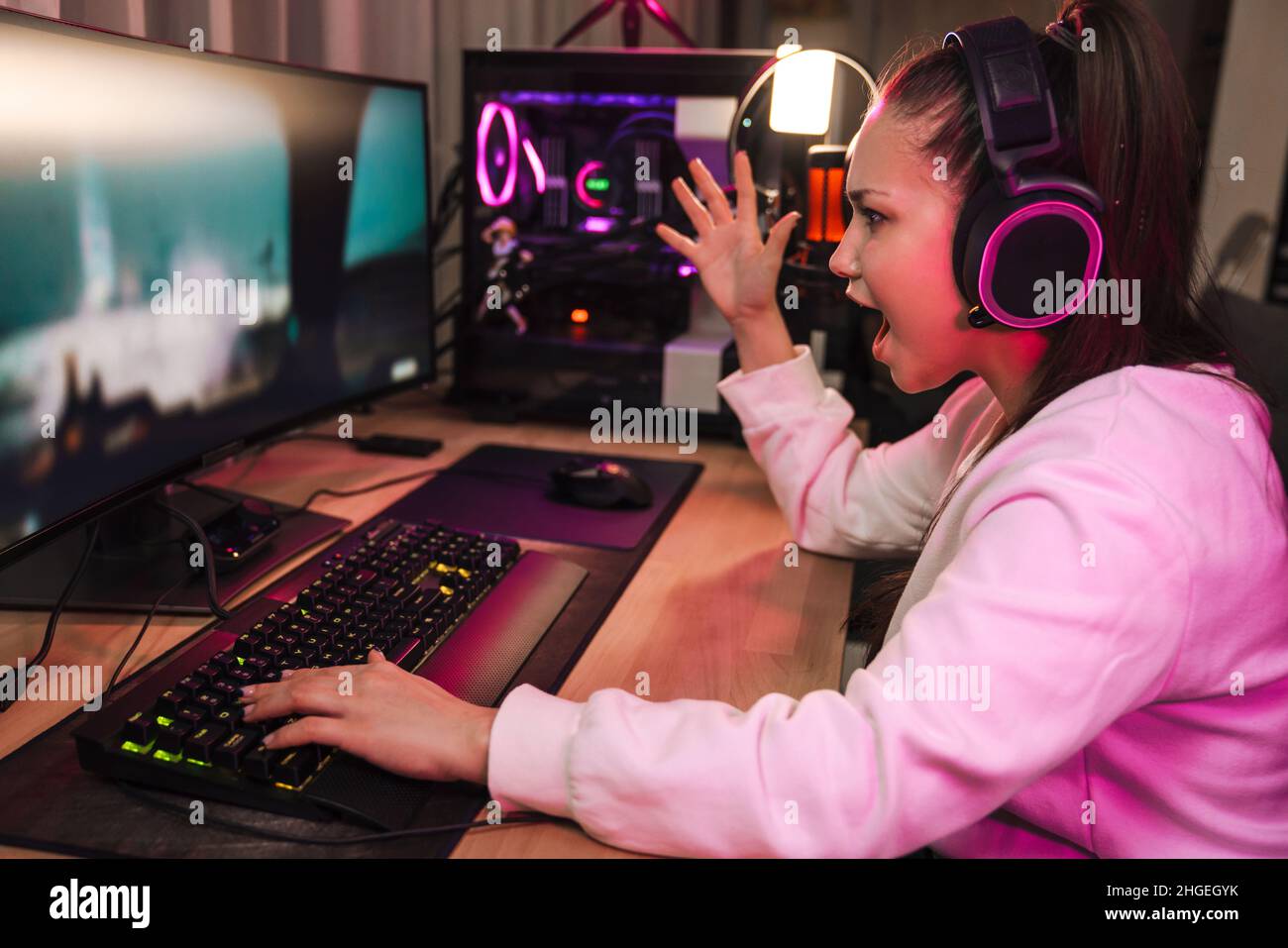 Angry devastated young man gamer wearing headphones lost a game on ...