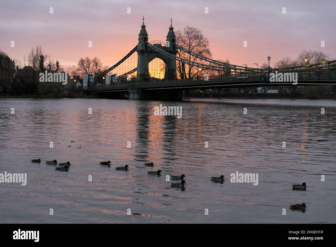 Hammersmith Bridge at dusk, as the winter light heads towards evening twilight, West London, England, United Kingdom Stock Photo