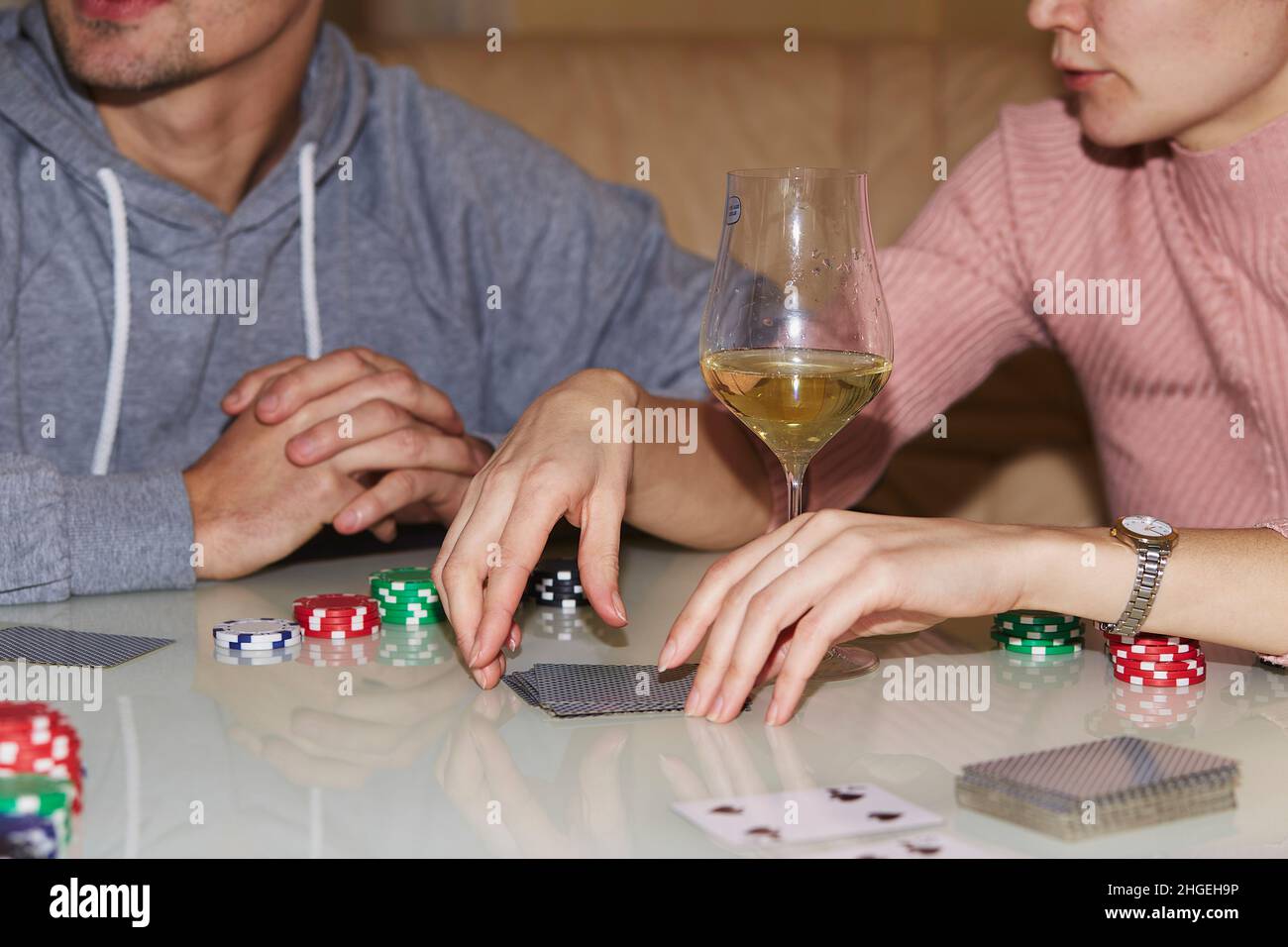 Players in poker game, dices, cards and glasess of champagne and whiskey. Candid moment. Poker background lifestyle photography. Enjoying the moment, digital detox with friends Stock Photo