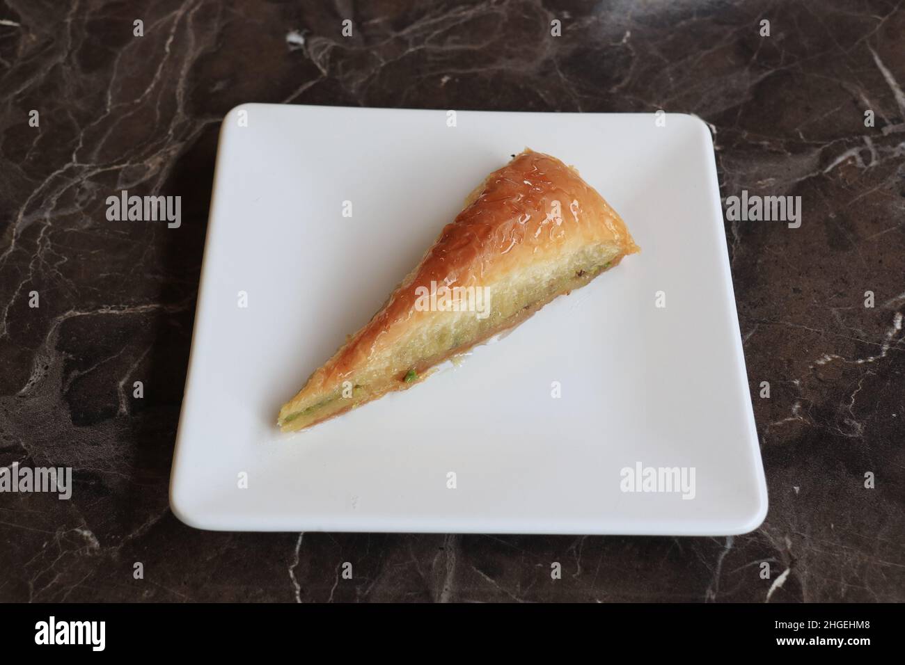 Baklava is a layered pastry dessert made of filo pastry, filled with