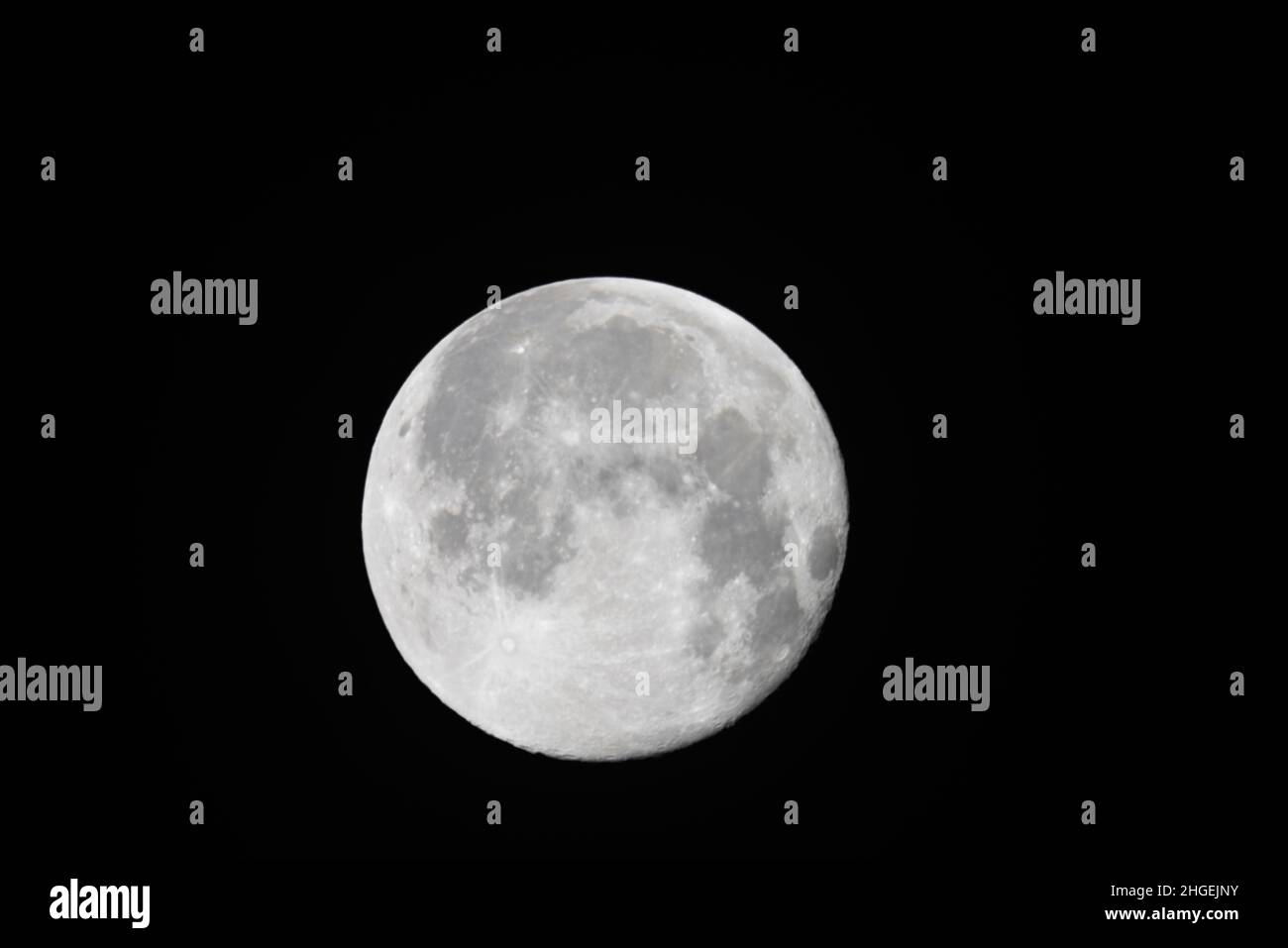 A full moon on a dark sky Stock Photo