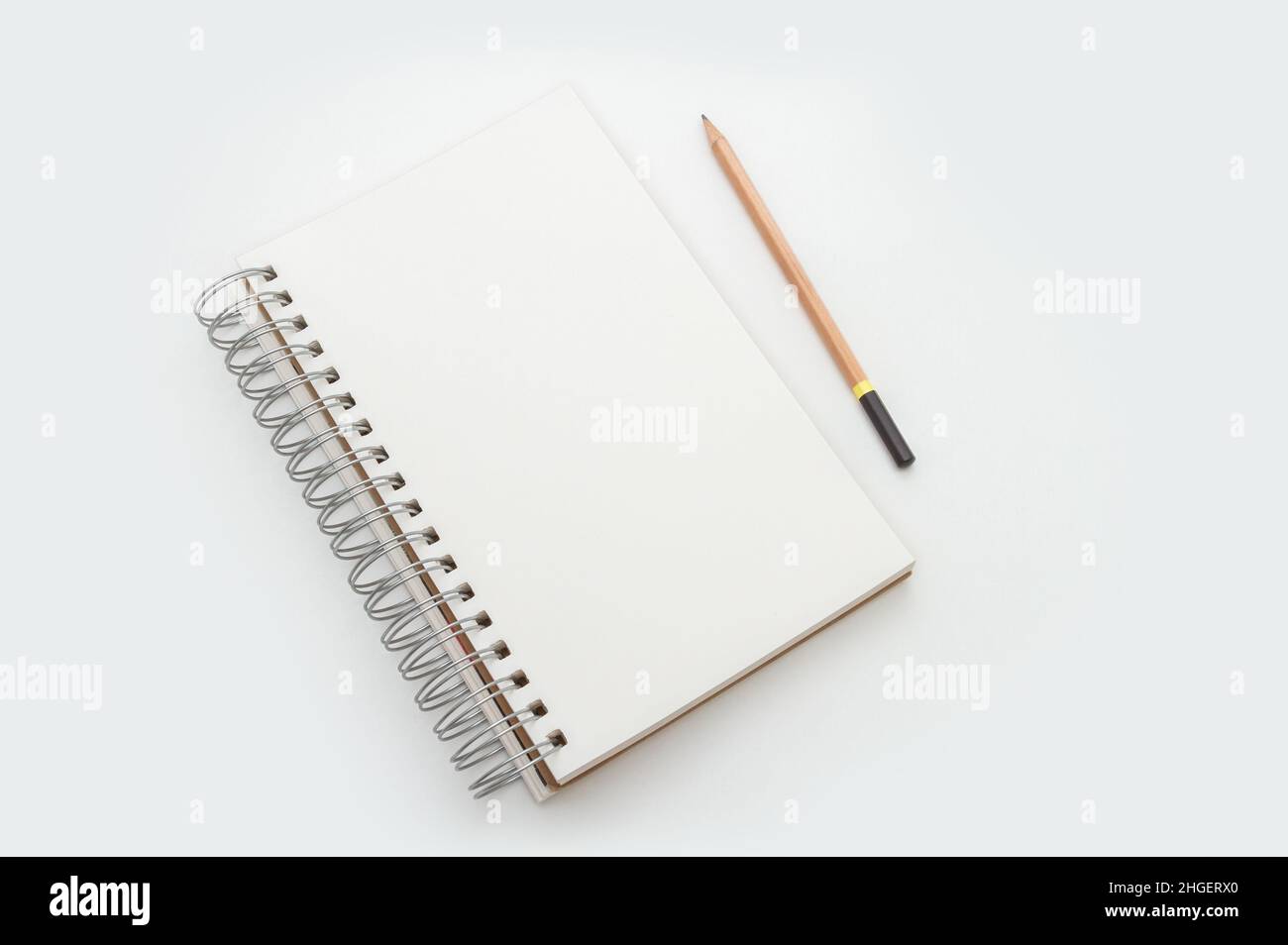 Blank Page Of A Sketchbook Over Gray Surface Stock Photo - Download Image  Now - Sketch Pad, Spiral, Workbook - iStock