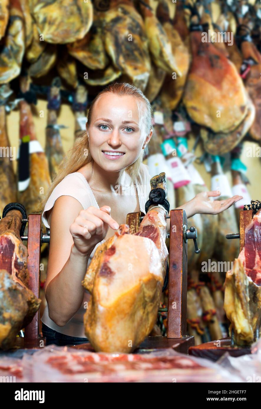 Woman picking delicious prosciutto meat Stock Photo Alamy