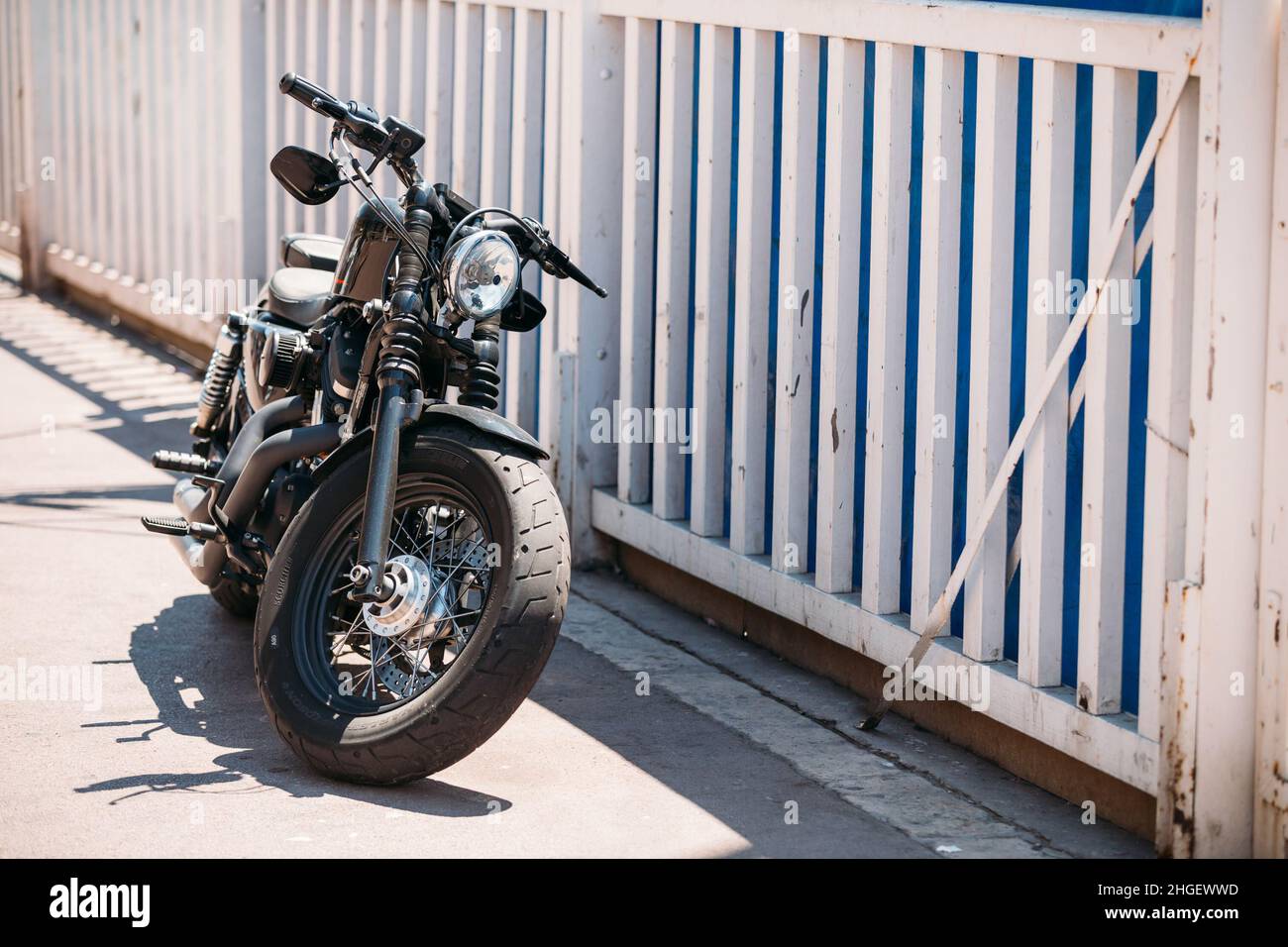 High power motorcycle HarleyDavidson parking on street Stock Photo Alamy