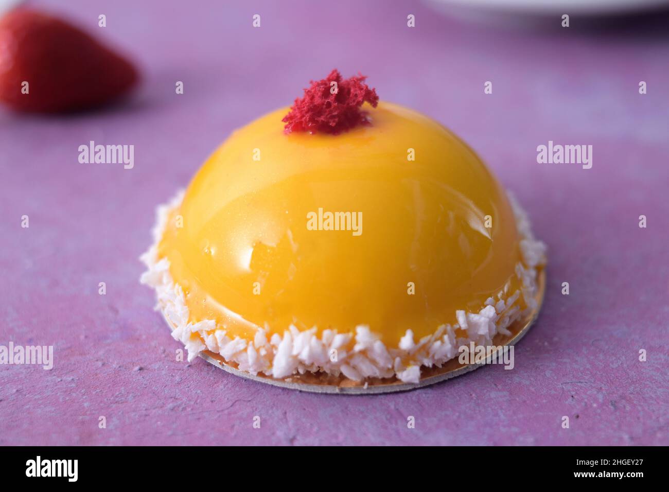 Photo of breakfast on a pink background. Latte coffee and a chic yellow