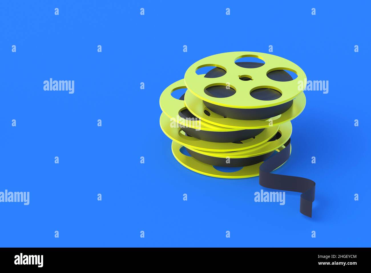 Film reel in metal frame of yellow color on blue background ...