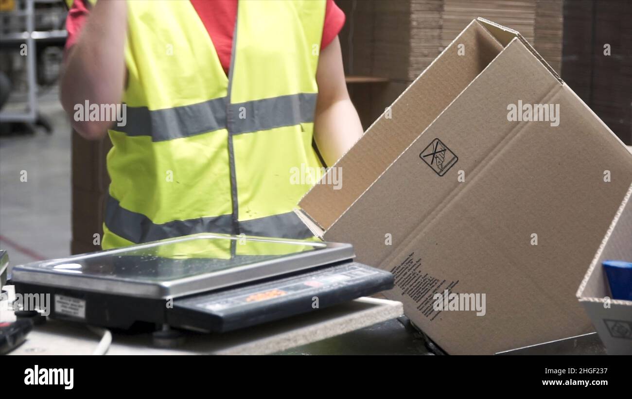 Delivery man putting carton boxes hi-res stock photography and images ...