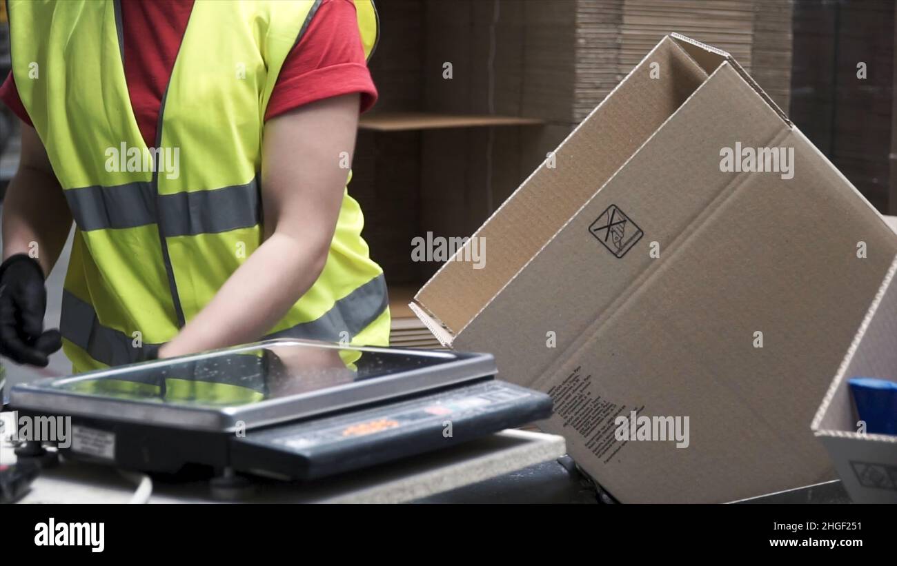 Delivery man putting carton boxes hi-res stock photography and images ...