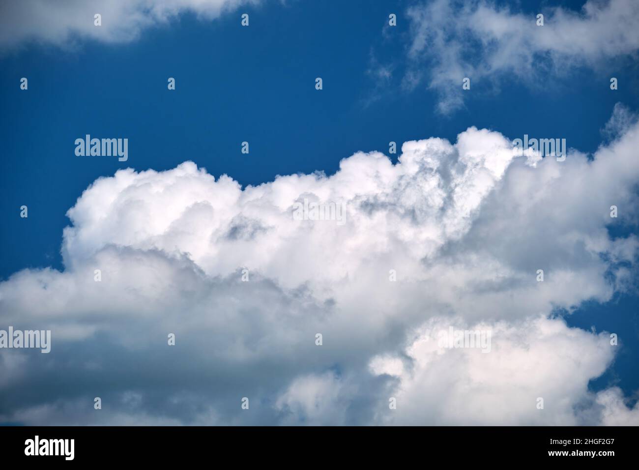 Bright landscape of white puffy cumulus clouds on blue clear sky Stock ...