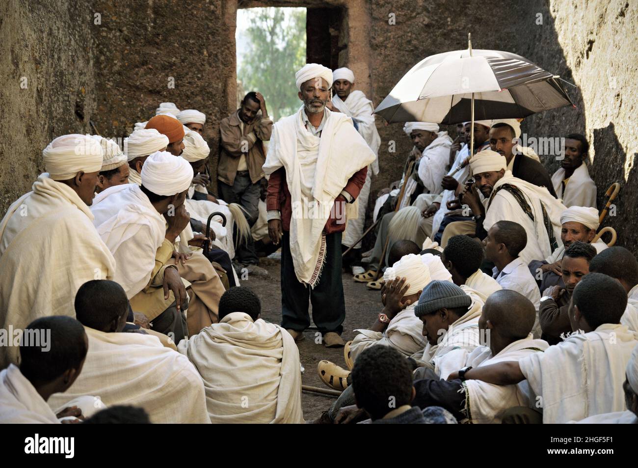 Priests meeting in a cavity at Lalibela, Amhara Region, Ethiopia Stock Photo