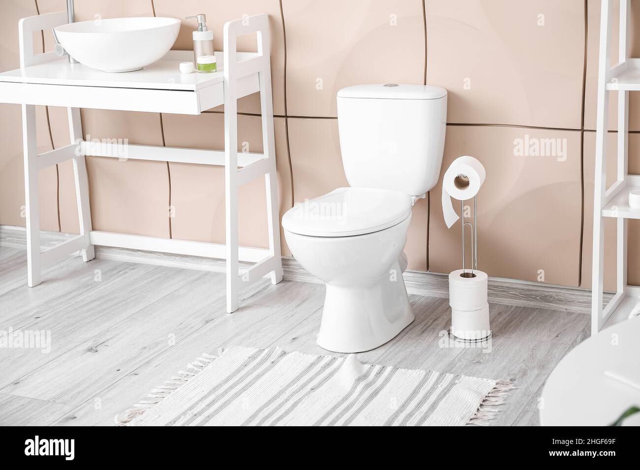 Interior of modern restroom with toilet bowl Stock Photo - Alamy