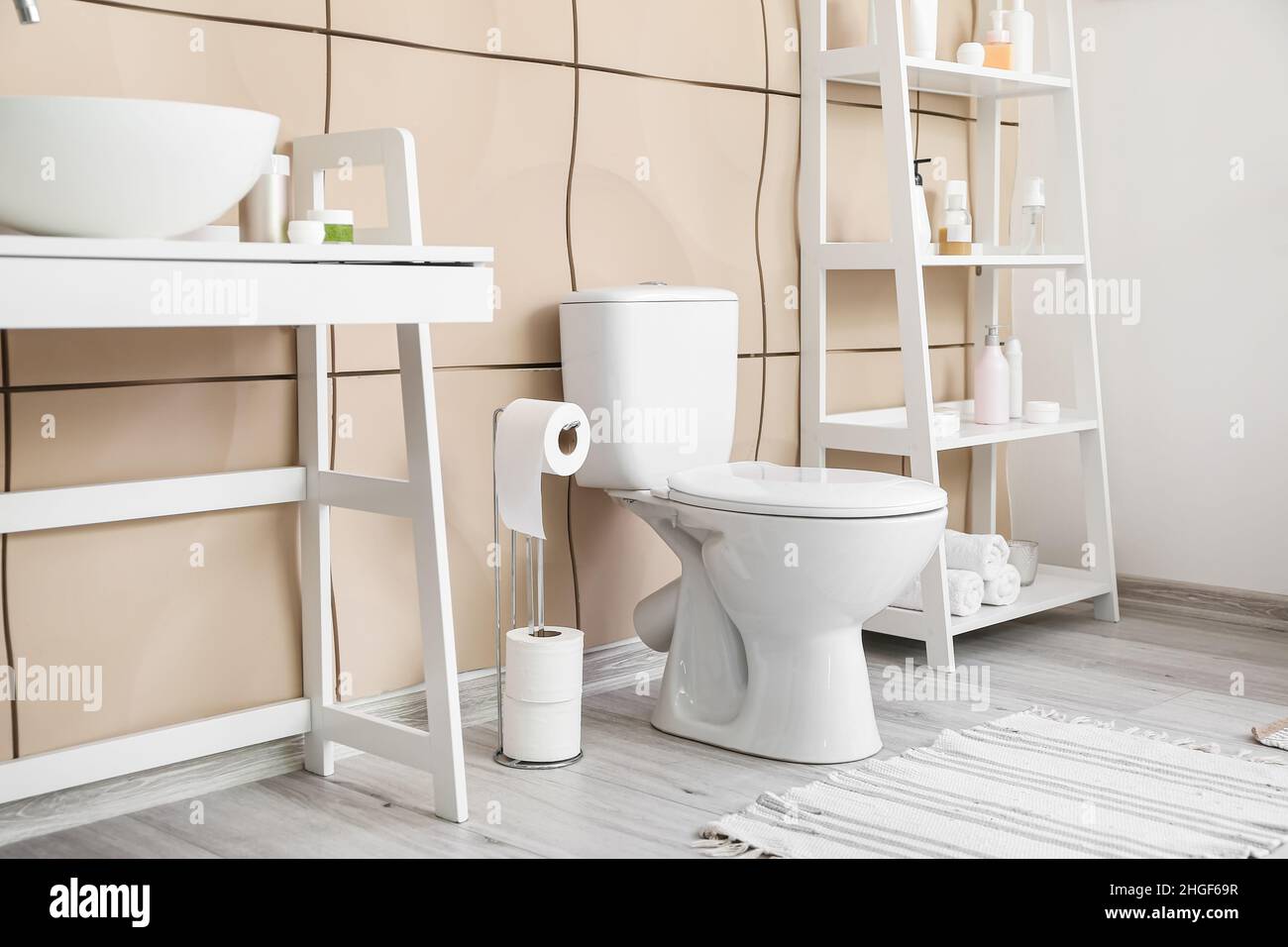 Interior of modern restroom with toilet bowl Stock Photo - Alamy