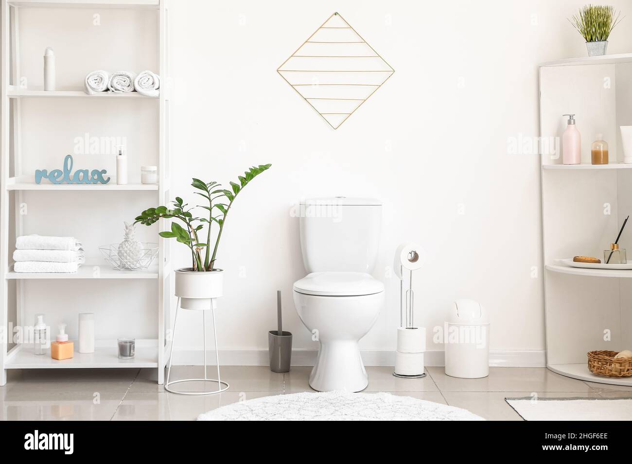 Interior of stylish modern restroom with toilet bowl Stock Photo - Alamy