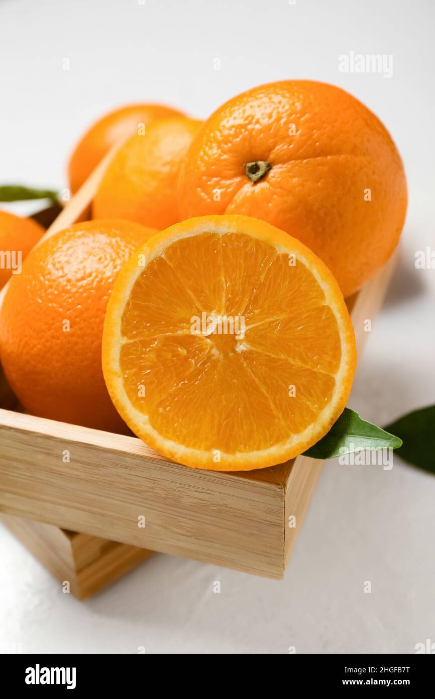 Wooden boxes with fresh oranges on white background Stock Photo - Alamy