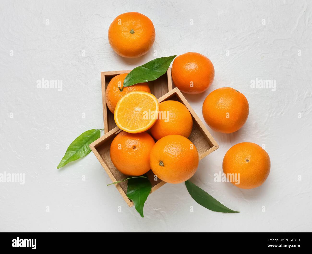 Wooden boxes with fresh oranges on white background Stock Photo - Alamy