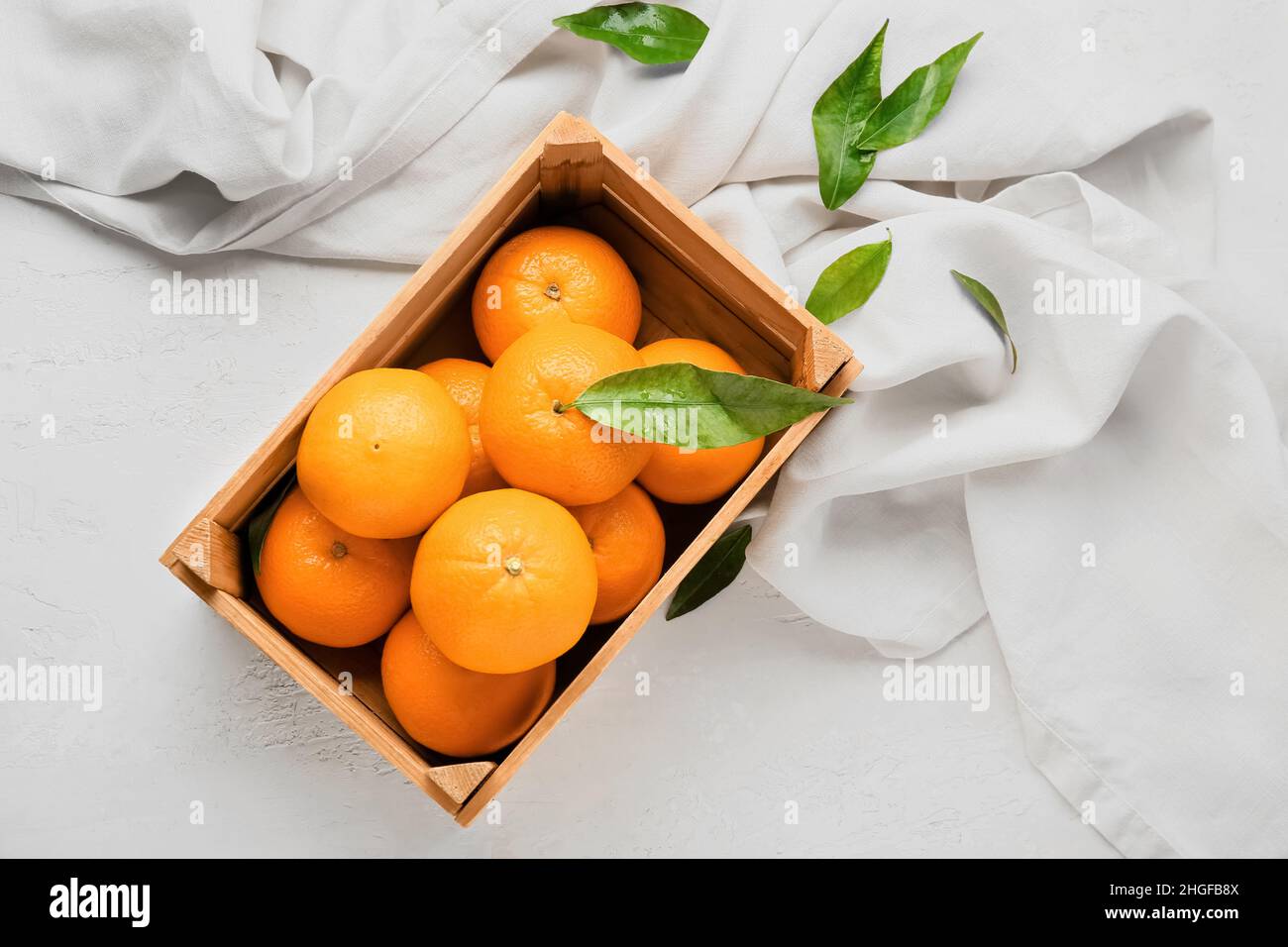 Wooden box with fresh juicy oranges on white background Stock Photo - Alamy