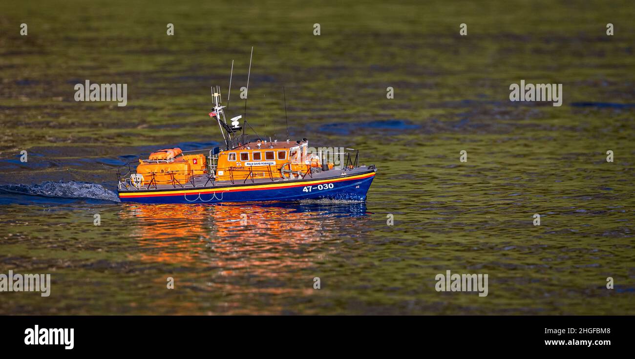 Close up of model RNLIB life boat on lake Stock Photo