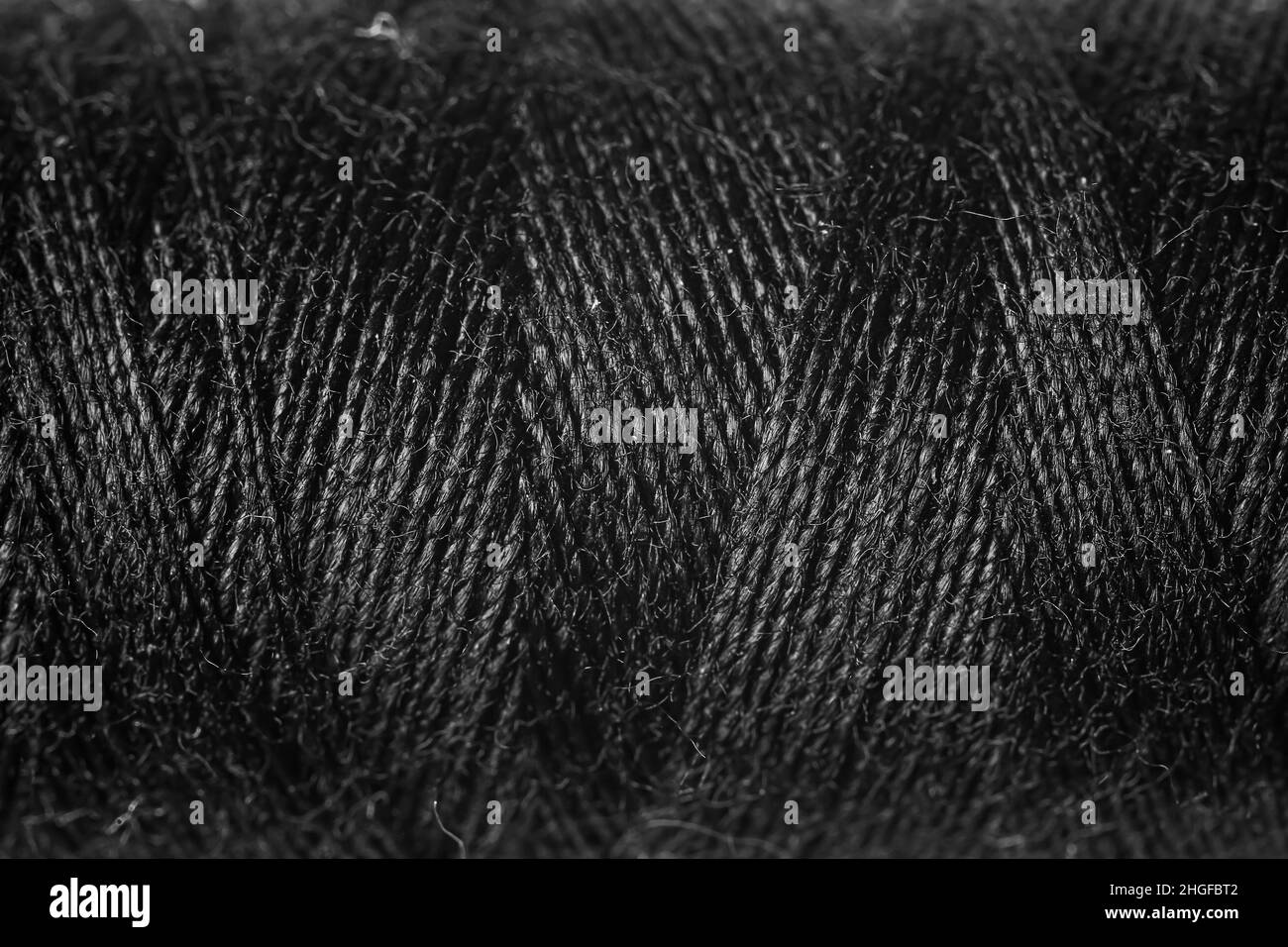 Premium AI Image  Black thread background texture Close up of black thread  for sewing