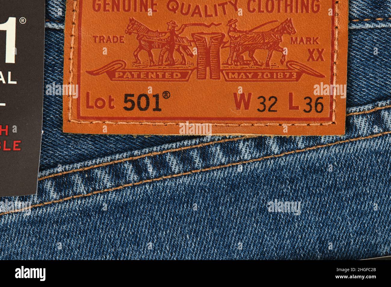 Close up of the details of new LEVI'S 501 Jeans. Seams and denim texture close-up. Classic jeans model. LEVI'S is a brand name of Levi Strauss and Co, Stock Photo